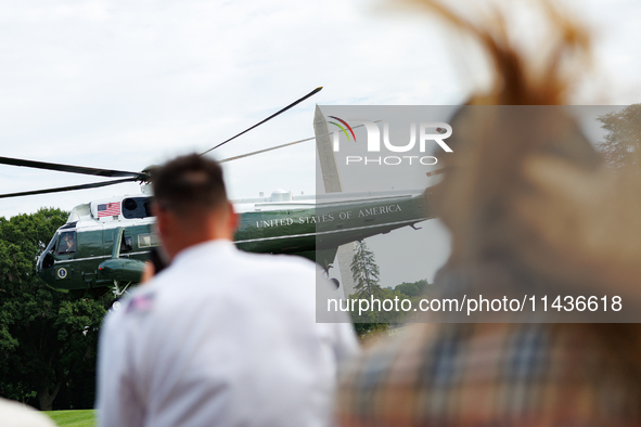 People watch as U.S. President Joe Biden departs the White House aboard Marine One en route to Camp David on July 26, 2024. 