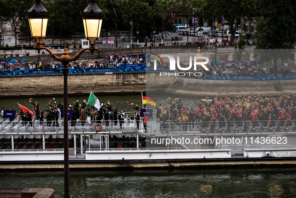 The boat is carrying the Albanian, Algerian, and German Olympic Teams during the opening ceremony of the Paris Olympic Games in Paris, Franc...