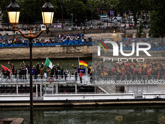 The boat is carrying the Albanian, Algerian, and German Olympic Teams during the opening ceremony of the Paris Olympic Games in Paris, Franc...