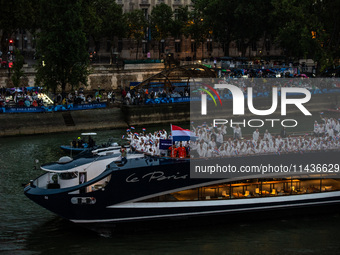 The boat carrying the Dutch Olympic team is sailing down the Seine on a boat called Le Paris, during the opening ceremony of the Paris 2024...