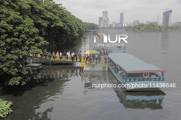 People are waiting in queue to board the water bus as government and non-government offices are opening today after 4 days of curfew followi...