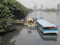 People are waiting in queue to board the water bus as government and non-government offices are opening today after 4 days of curfew followi...