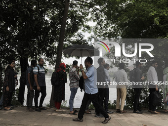 People are waiting in queue to board the water bus as government and non-government offices are opening today after 4 days of curfew followi...