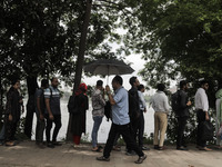 People are waiting in queue to board the water bus as government and non-government offices are opening today after 4 days of curfew followi...