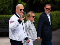 President Joe Biden boards Marine One with son Hunter Biden and sister Valerie Biden Owens at the White House, en route to Camp David, Washi...