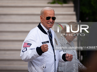 President Joe Biden boards Marine One sister Valerie Biden Owens at the White House, en route to Camp David, Washington, DC, July 26, 2024....