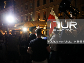 People are protesting against the screening of the film ''Green Border'' by Agnieszka Holland on the Main Square during the New Horizons Int...