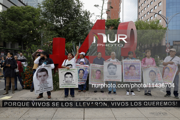 Mothers, fathers, and relatives of students from the Isidro Burgos Normal School in Ayotzinapa are demonstrating in Mexico City, Mexico, to...