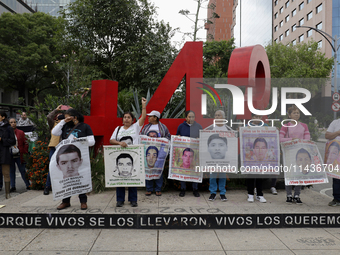 Mothers, fathers, and relatives of students from the Isidro Burgos Normal School in Ayotzinapa are demonstrating in Mexico City, Mexico, to...