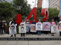 Mothers, fathers, and relatives of students from the Isidro Burgos Normal School in Ayotzinapa are demonstrating in Mexico City, Mexico, to...