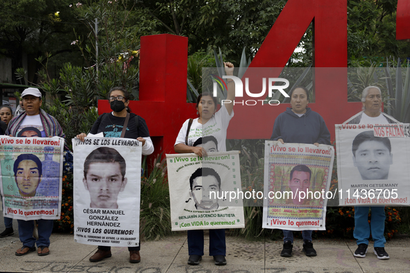 Mothers, fathers, and relatives of students from the Isidro Burgos Normal School in Ayotzinapa are demonstrating in Mexico City, Mexico, to...