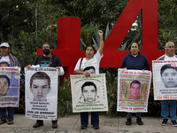 Mothers, fathers, and relatives of students from the Isidro Burgos Normal School in Ayotzinapa are demonstrating in Mexico City, Mexico, to...