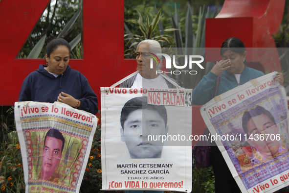 Mothers, fathers, and relatives of students from the Isidro Burgos Normal School in Ayotzinapa are demonstrating in Mexico City, Mexico, to...