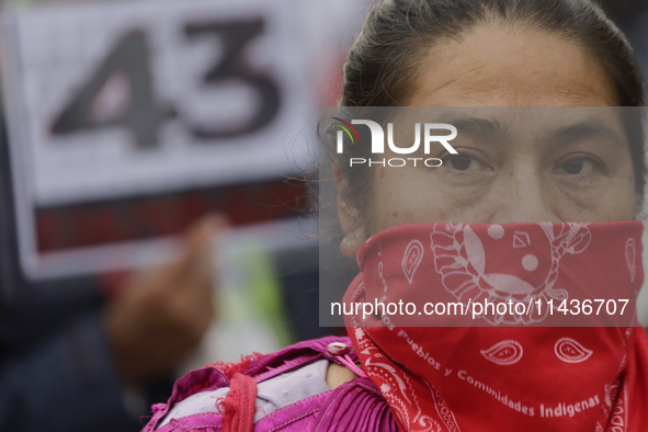 Mothers, fathers, and relatives of students from the Isidro Burgos Normal School in Ayotzinapa are demonstrating in Mexico City, Mexico, to...