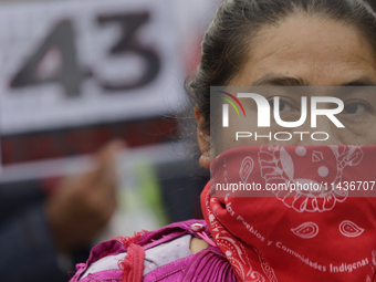 Mothers, fathers, and relatives of students from the Isidro Burgos Normal School in Ayotzinapa are demonstrating in Mexico City, Mexico, to...