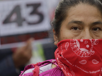 Mothers, fathers, and relatives of students from the Isidro Burgos Normal School in Ayotzinapa are demonstrating in Mexico City, Mexico, to...