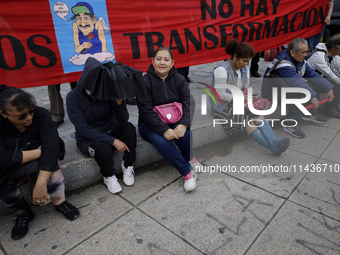 Mothers, fathers, and relatives of students from the Isidro Burgos Normal School in Ayotzinapa are demonstrating in Mexico City, Mexico, to...