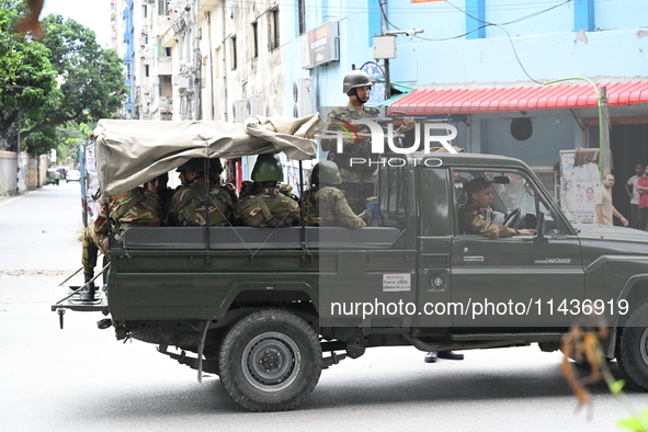 The Bangladesh Army is patrolling the street as authorities are easing the curfew, which came into effect after student protests against the...