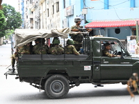 The Bangladesh Army is patrolling the street as authorities are easing the curfew, which came into effect after student protests against the...