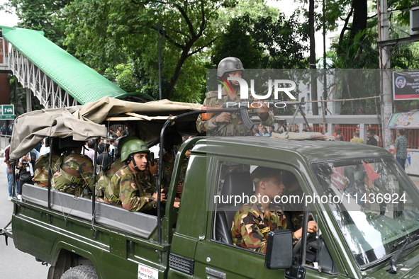 The Bangladesh Army is patrolling the street as authorities are easing the curfew, which came into effect after student protests against the...