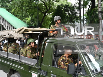 The Bangladesh Army is patrolling the street as authorities are easing the curfew, which came into effect after student protests against the...