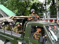 The Bangladesh Army is patrolling the street as authorities are easing the curfew, which came into effect after student protests against the...