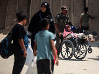 Palestinians are fleeing the eastern part of Khan Younis as they make their way after being ordered by the Israeli army to evacuate their ne...