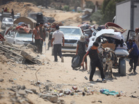 Palestinians are fleeing the eastern part of Khan Younis as they make their way after being ordered by the Israeli army to evacuate their ne...