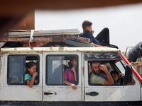 Palestinians are fleeing the eastern part of Khan Younis as they make their way after being ordered by the Israeli army to evacuate their ne...