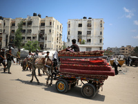 Palestinians are fleeing the eastern part of Khan Younis as they make their way after being ordered by the Israeli army to evacuate their ne...