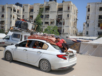 Palestinians are fleeing the eastern part of Khan Younis as they make their way after being ordered by the Israeli army to evacuate their ne...