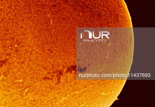 (EDITOR'S NOTE: This image was captured with an H-Alpha solar telescope and is the result of stacking the best 20% of frames. The final stac...