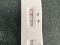 A positive COVID-19 rapid test is being shown at a doctor's office in Toronto, Ontario, Canada, on July 23, 2024. COVID-19 numbers are spiki...