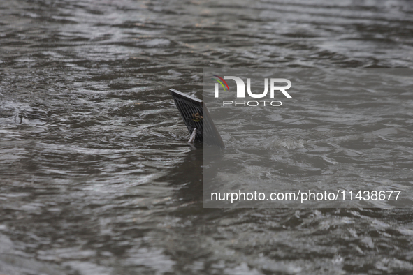 A drain is flooding on Avenida Tlahuac in Mexico City after flooding is reported in various areas of the capital. 