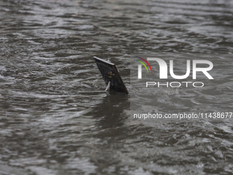 A drain is flooding on Avenida Tlahuac in Mexico City after flooding is reported in various areas of the capital. (