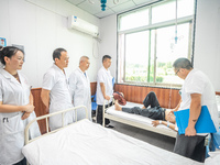 Doctors are exchanging cases at the Second People's Hospital of Jinsha County in Bijie, China, on July 17, 2024. (