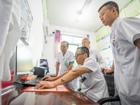 Doctors are exchanging cases at the Second People's Hospital of Jinsha County in Bijie, China, on July 17, 2024. (