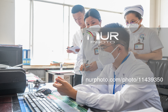 Doctors are exchanging cases at the Second People's Hospital of Jinsha County in Bijie, China, on July 17, 2024. 