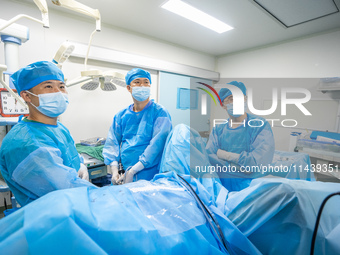 A doctor is performing laparoscopic lithotomy on a patient at the Second People's Hospital of Jinsha County in Bijie, China, on July 17, 202...