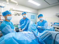 A doctor is performing laparoscopic lithotomy on a patient at the Second People's Hospital of Jinsha County in Bijie, China, on July 17, 202...