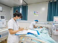 A doctor is performing hemodialysis treatment on a patient at the Second People's Hospital of Jinsha County in Bijie, China, on July 17, 202...