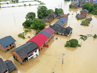 Rescue workers are moving trapped people in Jingtang village, Tangdong Subdistrict, Zixing city, Central China's Hunan province, on July 28,...