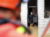 Rescue workers are moving trapped people in Jingtang village, Tangdong Subdistrict, Zixing city, Central China's Hunan province, on July 28,...