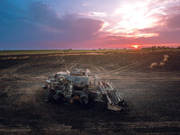 A combine is sparking a devastating fire in a wheat field in Orangeville, IL, rapidly spreading and engulfing a significant portion of the c...