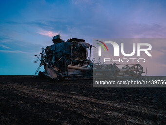 A combine is sparking a devastating fire in a wheat field in Orangeville, IL, rapidly spreading and engulfing a significant portion of the c...