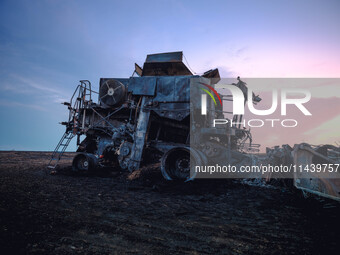 A combine is sparking a devastating fire in a wheat field in Orangeville, IL, rapidly spreading and engulfing a significant portion of the c...