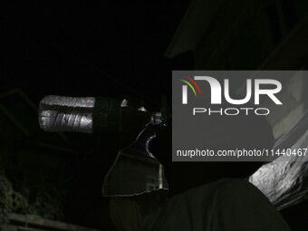 A man is drinking water outside his home on a hot summer evening in Srinagar, Jammu and Kashmir, on July 28, 2024. Kashmir is reeling under...