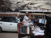 Displaced Palestinians are leaving al-Bureij refugee camp towards the west, after the Israeli army issued a new evacuation order, in the cen...