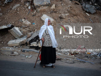 Displaced Palestinians are leaving al-Bureij refugee camp towards the west, after the Israeli army issued a new evacuation order, in the cen...