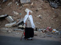 Displaced Palestinians are leaving al-Bureij refugee camp towards the west, after the Israeli army issued a new evacuation order, in the cen...